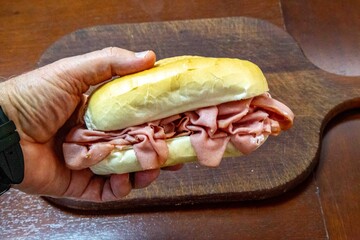 Delicious Mortadella Sandwich on a Wooden Board