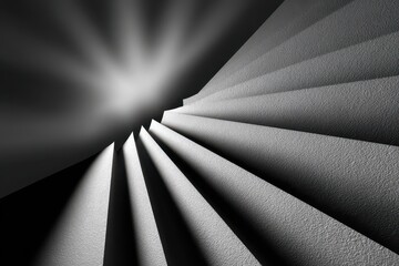 Dramatic monochrome abstract design with light rays illuminating textured folds