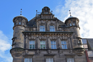 Facade of Ornate Victorian Stone Office Building  with Turrets seen from Below 