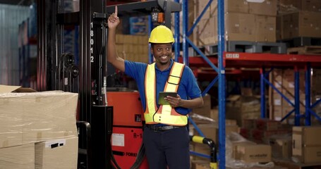 male african american warehouse inspector holding tablet smiling confidently in safety gear standing beside forklift during work inspection in logistic cargo stock facility warehouse environment - Powered by Adobe