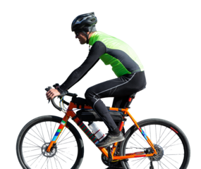 Cyclist riding bicycle on road against clear sky