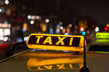 taxi on a city street at night
