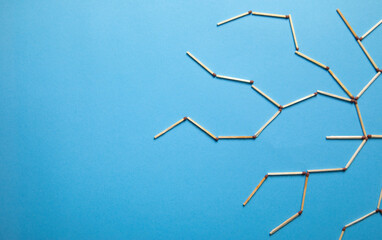 Global network connection made by match on the blue background.