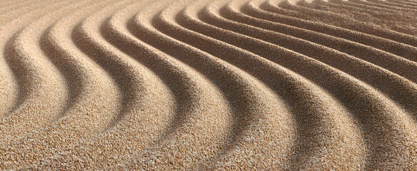 The meditative pattern of raked sand forms calming elegant flowing lines.