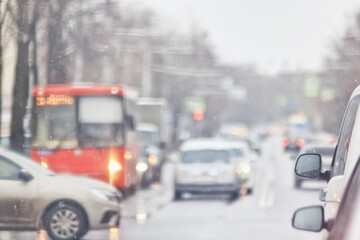 Autumn on a city highway, blurred background, traffic in gloomy weather, cars, cloudy day