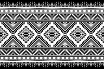 Fotobehang Afrikaanse Motieven Geometric abstract ethnic pattern seamless Minimal black and white tribal motifs in black background.  © NARONG JHANWATTANA