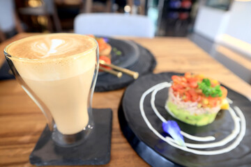 cappuccino, coffee in a clear glass cup in a cafe, soft color background food and drink, hot drink