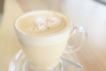 cappuccino, coffee in a clear glass cup in a cafe, soft color background food and drink, hot drink