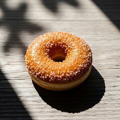 Delicious sugary donut glistening in sunlight on rustic wooden surface