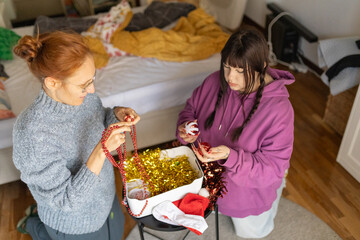 Women decorating home for christmas holiday season