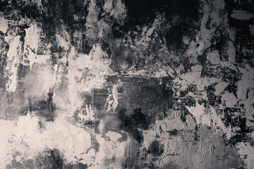 Grunge black and white textured wall with brush strokes for abstract background and artistic expression