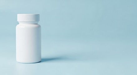 Blank white medicine bottle against a light blue background for pharmaceutical product mockup and healthcare advertisement.