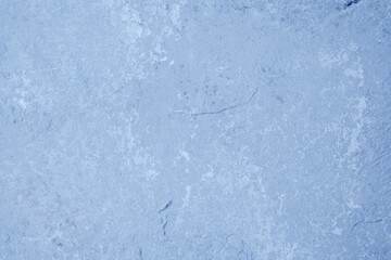 Grunge blue wall with textured plaster and worn vintage finish