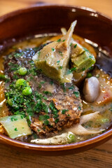 Corvina in green sauce with artichokes and 