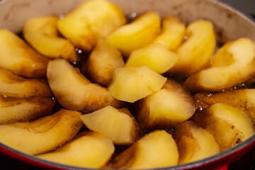 cooking apple pieces for Tatin apple pie, caramelized apples in butter and sugar, Mallorca, Balearic Islands, Spain