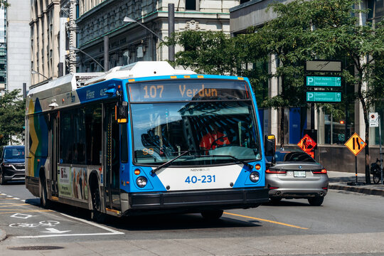 Montreal, Canada - August 14, 2025: city bus route 107 Verdun on downtown street with historic buildings in Montreal