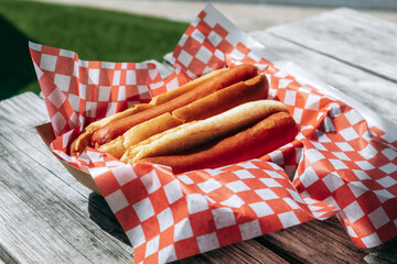 Hot dog in paper tray outdoors