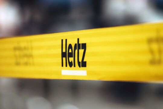 Montreal, Canada - August 15, 2025: Yellow Hertz rental car barrier strap at Montreal Trudeau Airport