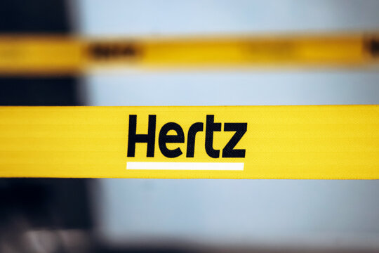 Montreal, Canada - August 15, 2025: Yellow Hertz rental car barrier strap at Montreal Trudeau Airport