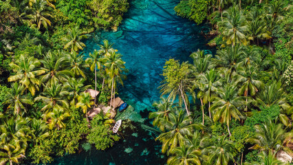 Crystal lake with blue water in Indonesia. Drone view