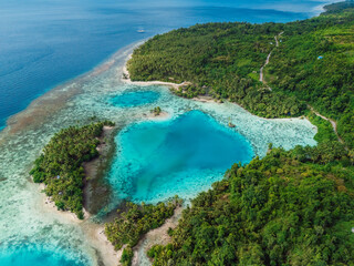 Coastline with lagoon and tropical scenic landscape in Indonesia. Aerial view