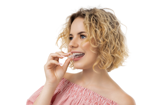 Young woman engages in teeth alignment with clear brace, isolated, PNG