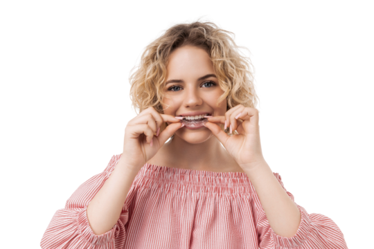 Woman is applying clear aligners to straighten teeth, isolated, PNG