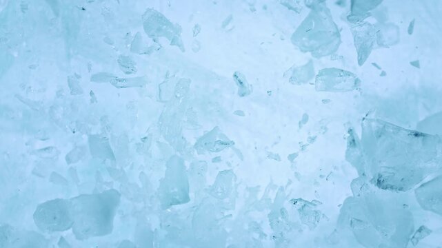 Super Slow Motion of Exploding Ice Shards . Filmed on High Speed Cinema Camera at 1000 FPS