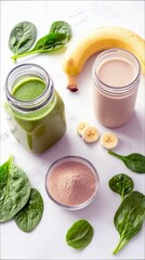 Two drinks, a green smoothie and a protein shake, are arranged with fresh spinach leaves, sliced bananas, and a bowl of protein powder on a white surface.