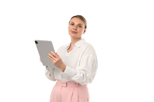 Confident woman in white blouse with tablet, isolated on white, PNG