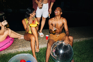 Friends enjoying a backyard summer night party