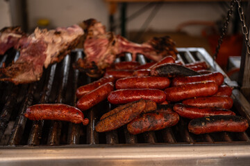 Close-Up of Sausages and Meat on Grill