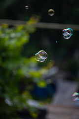 soap bubble is flying through the air 