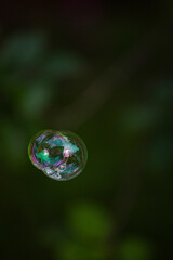 soap bubble is flying through the air 