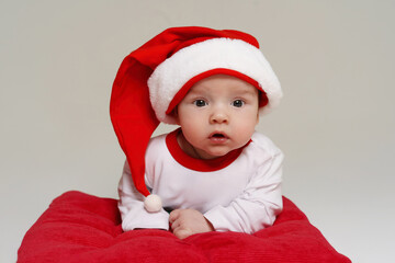 Cute baby wearing a Santa Claus hat