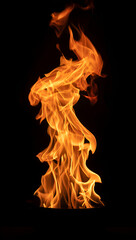 Fototapeta premium Dynamic orange fire flames on a dark isolated background concept