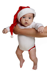 Cute baby wearing a Santa Claus hat