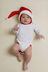 Cute baby wearing a Santa Claus hat