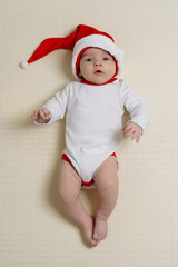 Cute baby wearing a Santa Claus hat