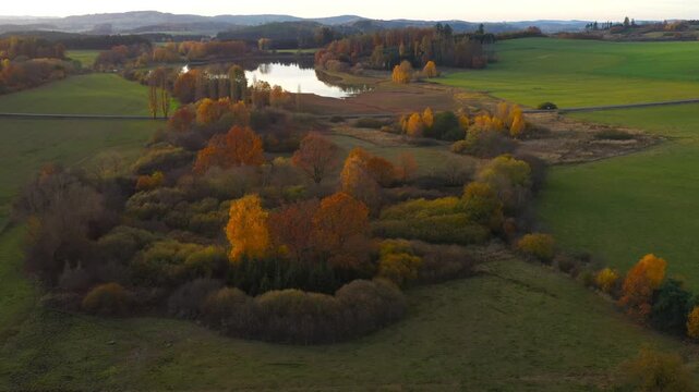 Drone flight over the South Bohemian landscape at the end of October. Colorful harmony of nature in autumn. Czech Republic, Central Europe.