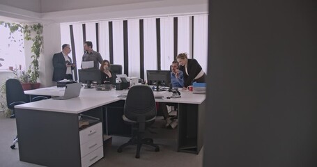 Business colleagues collaborate on a project, discussing strategies and analyzing data in a modern office environment. - Powered by Adobe