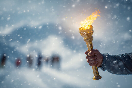Winter torch relay taking place in snowy mountains during a celebration event