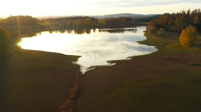 South Bohemian pond in autumn. Calm evening atmosphere in aerial footage. Czech Republic, Europe.	
