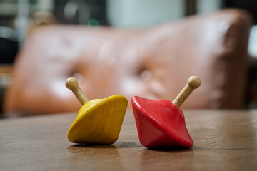 wooden spinning tops on a living room coffee table