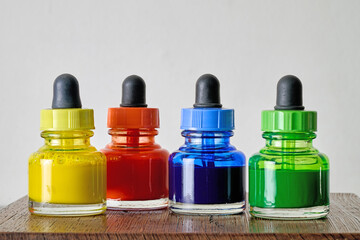 Indoor. Small bottles of colored watercolors