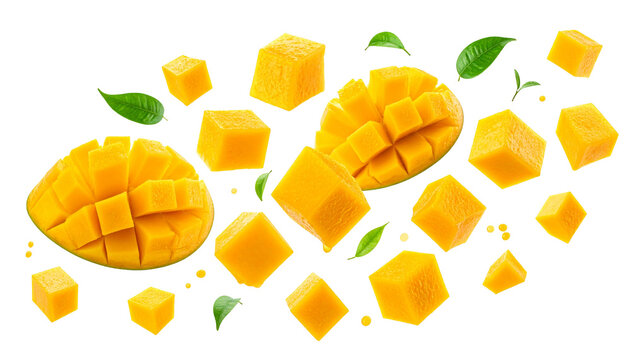 Fresh ripe mango cubes and sliced halves falling or flying, isolated on a clean white background