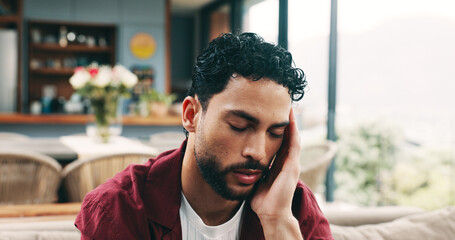 Tired man, headache and eye strain with pain on sofa for burnout, fatigue or stress in home....