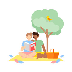 Gay couple reading a book together on picnic blanket under tree  