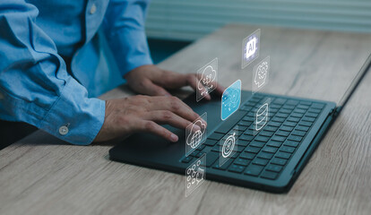 Hands typing on laptop with floating AI and technology icons representing cloud computing, automation, data processing innovation Concept of modern digital transformation artificial intelligence tools