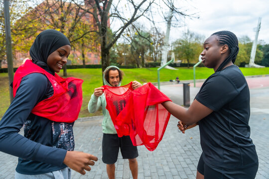 Diverse friends preparing for a friendly basketball game